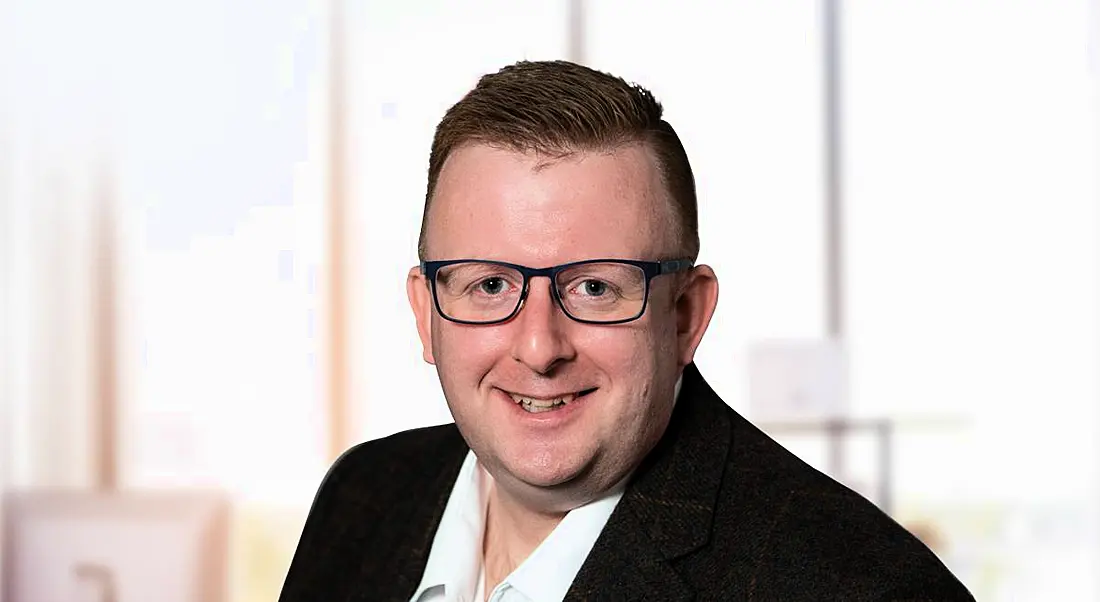 A man wearing a suit jacket over a white shirt. He is medtech professional Brian Callaghan of Viatris Global Device Development.