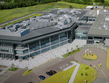 An artist’s rendering of a large Stryker manufacturing facility surrounded by green fields in Cork.