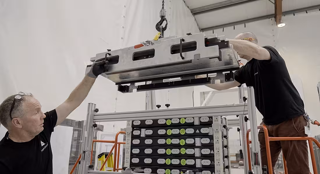 Two men working on a battery manufacturing project with machinery at Xerotech.