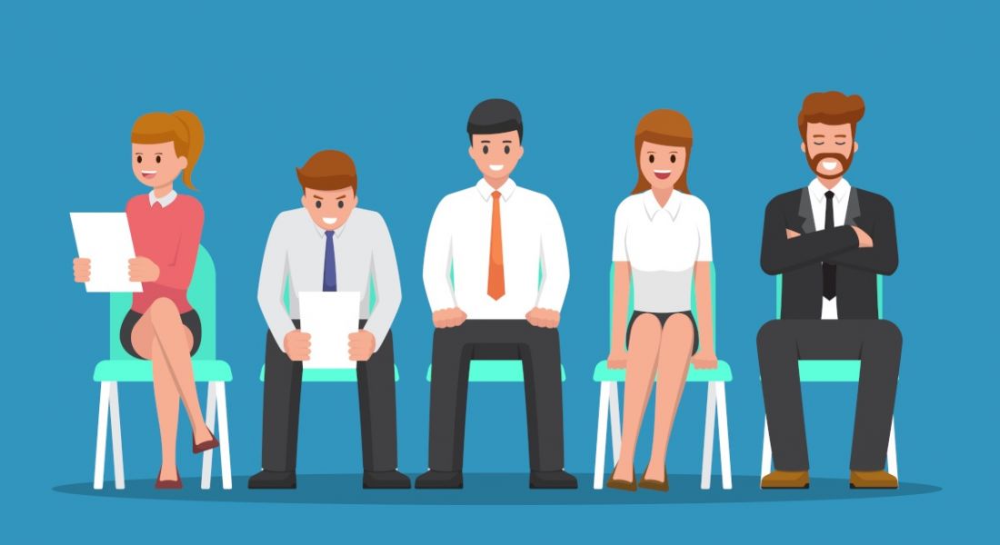Cartoon of five people sitting on chairs dressed in business attire and holding pieces of paper like they are waiting for a job interview.