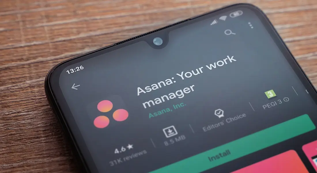 A smartphone displaying the Asana app install page in the Android app store.