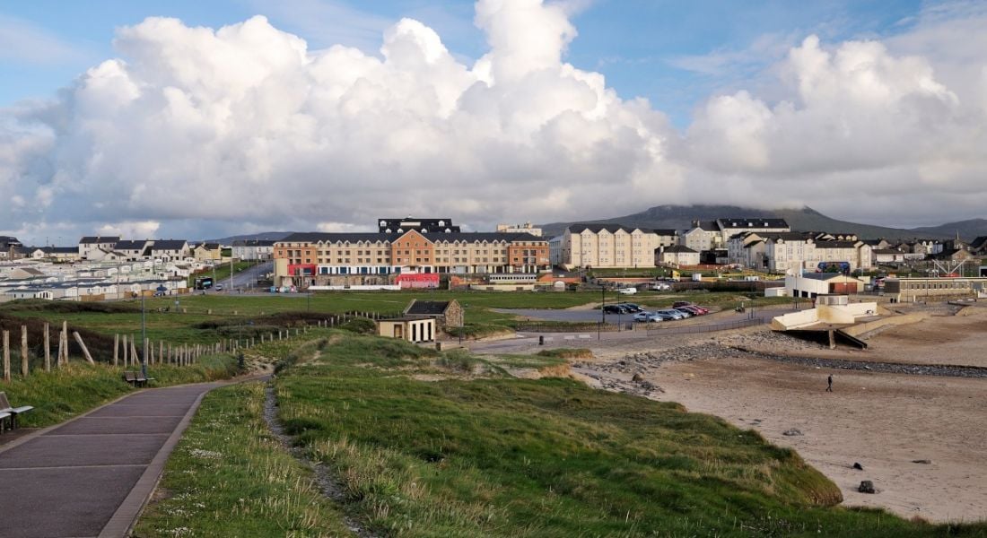 Panoramic view of Bundoran Donegal showing coastline and a view of the town on a cloudy day.