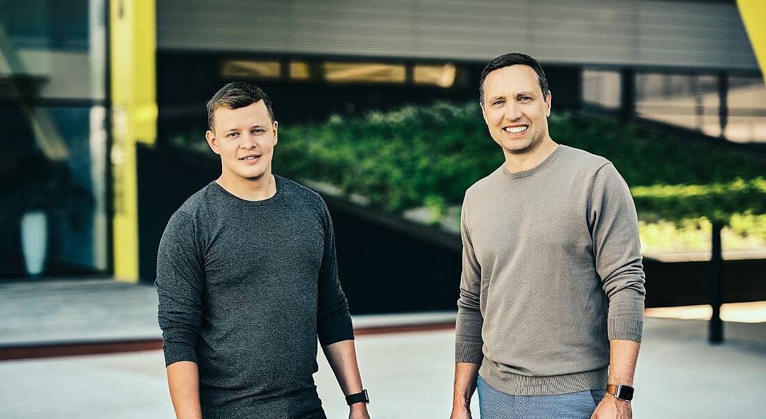 Hubert Palan and Dan Hejl founders of Productboard standing outside a building looking at the camera.