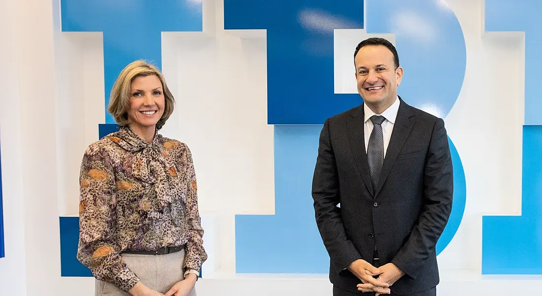 IBM's Deborah Threadgold and Leo Varadkar stand in front of a wall with the IBM logo in the background.