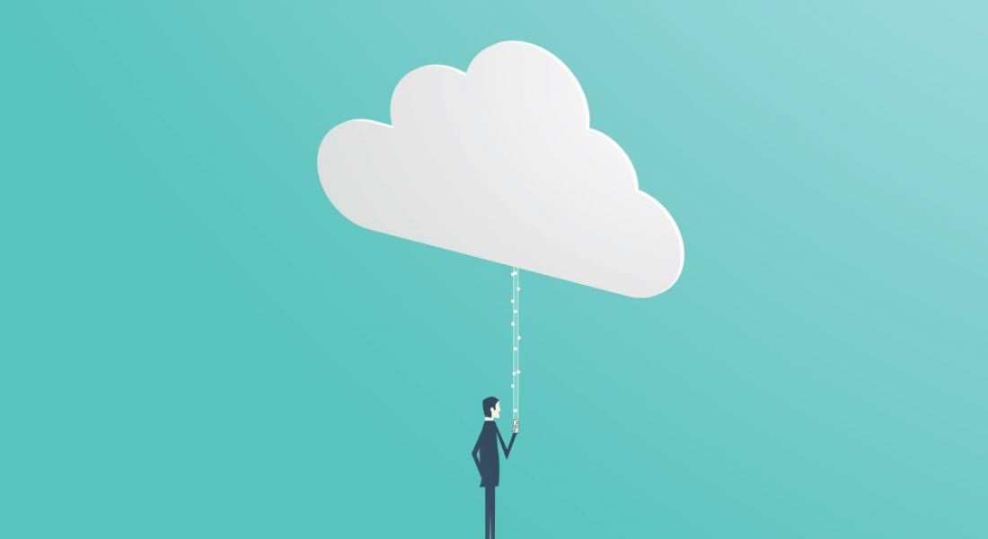 A vector image of a man looking at his phone while several white lines connect the phone to a large white cloud, symbolising cloud computing.