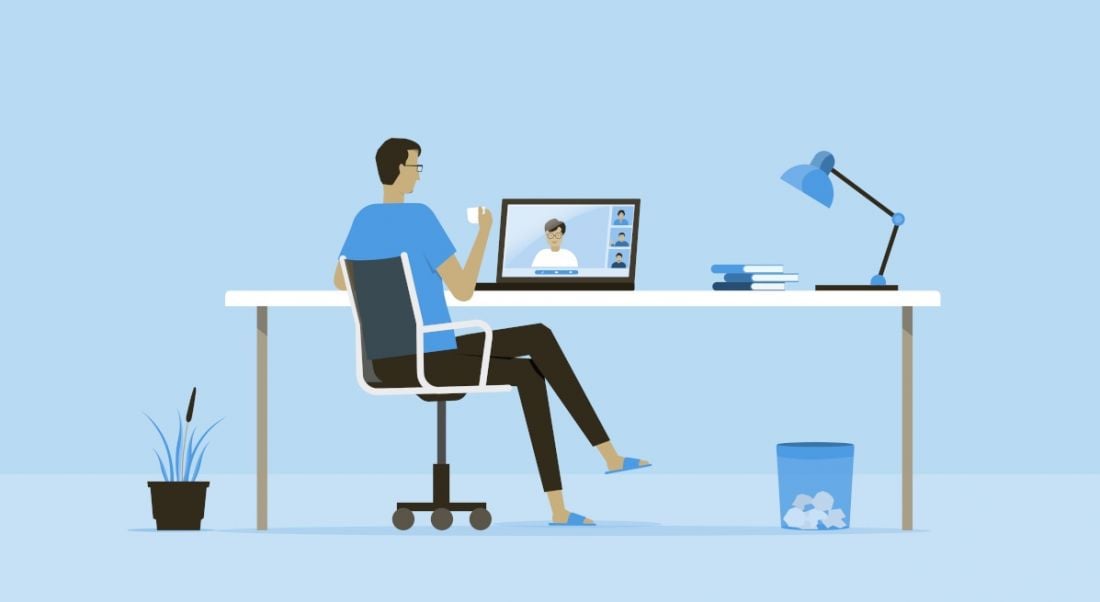 A graphic image of a man sitting at a desk while on a video call on a laptop, symbolising hybrid working.