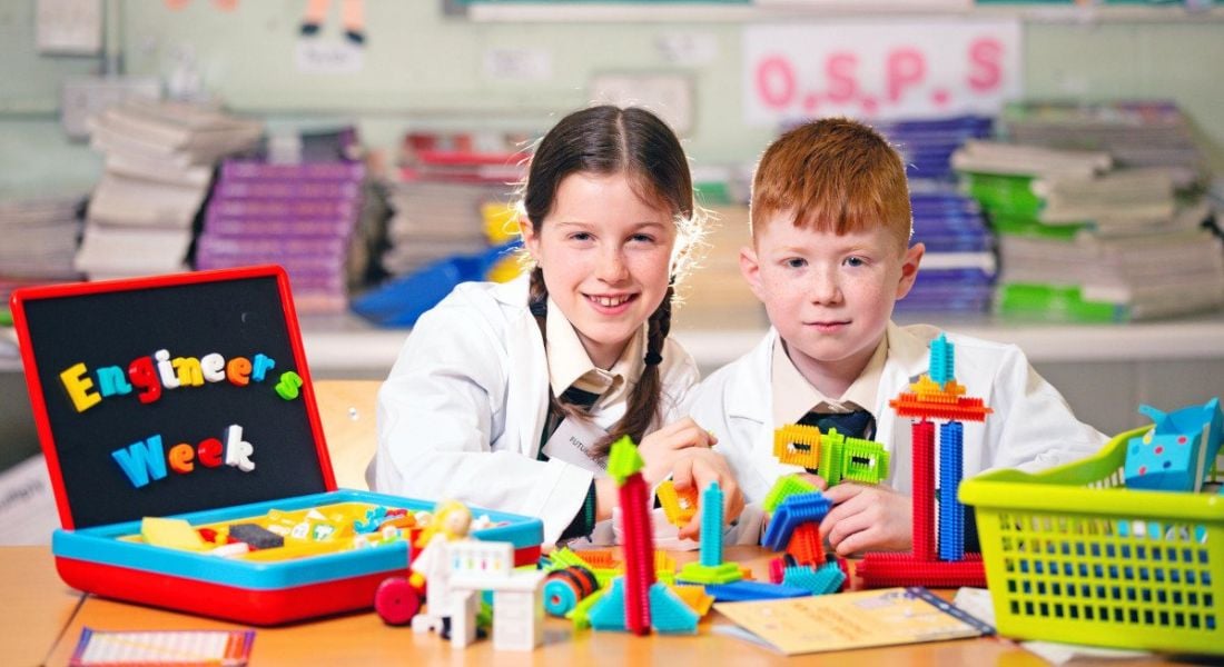 Caoimhe Ni Chorragain and Logan Finnegan enjoying Engineers Week 2022 at a classroom festooned with toys and decorations at Scoil Chearbhaill Ui Dhalaigh, Leixlip.