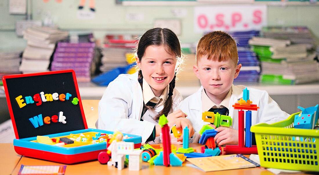 Caoimhe Ni Chorragain and Logan Finnegan enjoying Engineers Week 2022 at a classroom festooned with toys and decorations at Scoil Chearbhaill Ui Dhalaigh, Leixlip.