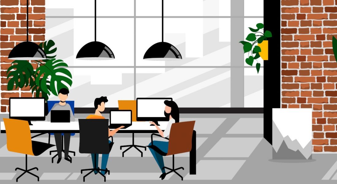 Cartoon featuring three people working at a communal desk in a co-working hub with bright, modern interiors.