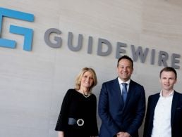 John O'Sullivan, Martin Corkery and Caroline Horgan stand outside an office that says 'Zevas' on the wall.