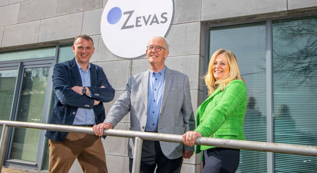 John O'Sullivan, Martin Corkery and Caroline Horgan stand outside an office that says 'Zevas' on the wall.