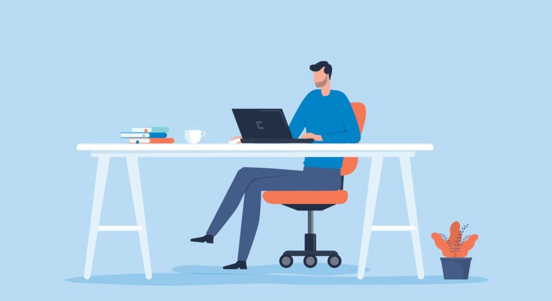 A cartoon image of a man sitting at a desk working from home, symbolising the remote working bill.