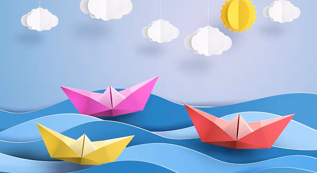 A graphic of origami paper boats floating on the sea.