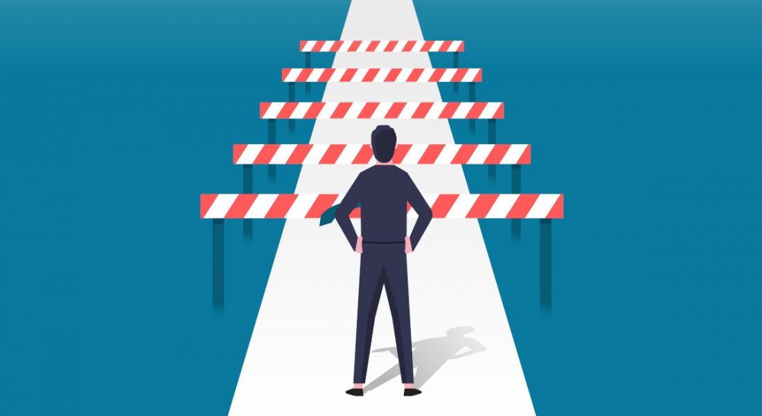 Man facing barriers on a path. Cartoon inaccessibility concept.
