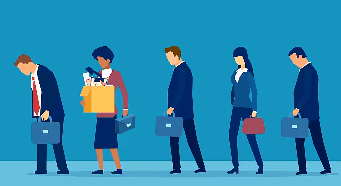 A cartoon image of a line of sad business people walking in a line, one of which is holding a carboard box, symbolising mass layoffs.
