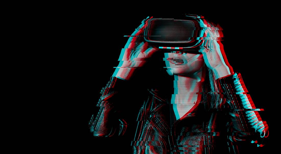 Extended reality concept showing a girl wearing a VR headset.