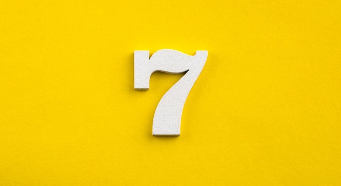 white number seven on a yellow background.