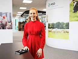 Louise Hopper of DCU Futures standing in front of some students talking to them. They are in a classroom.