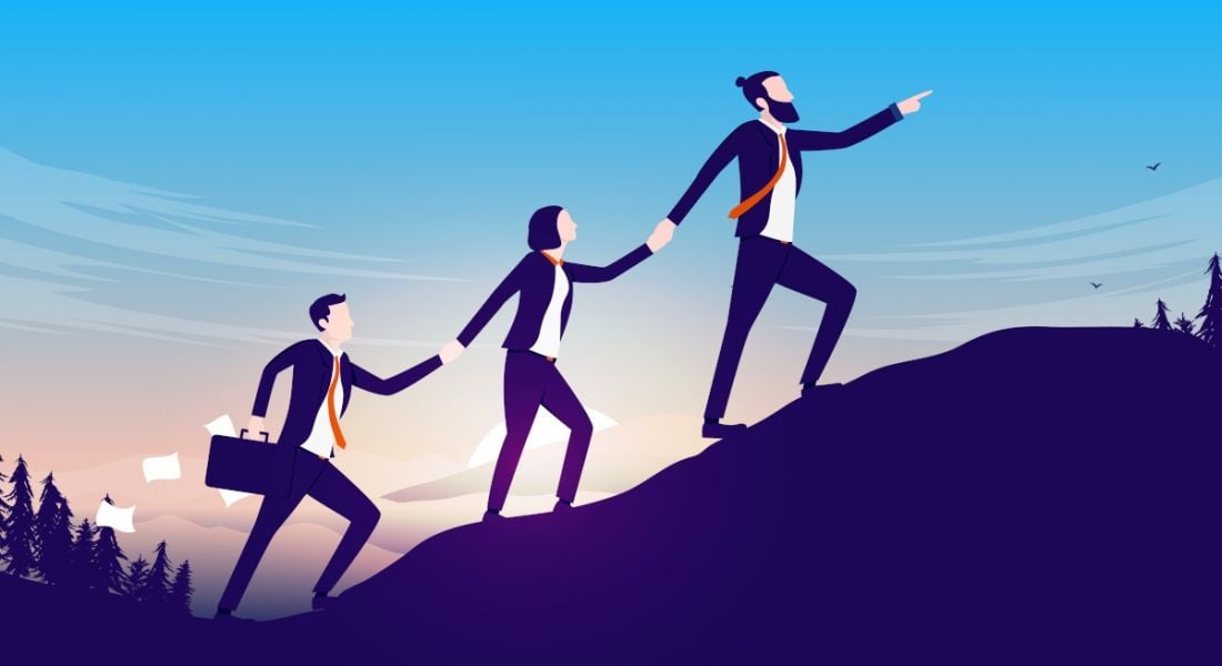 A cartoon of three people in business suits holding hands while climbing a hill, symbolising motivating teams.