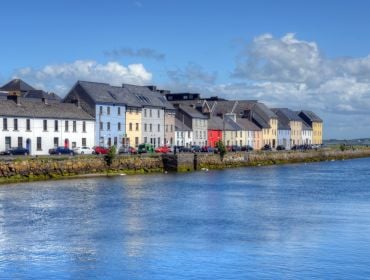 A view of the Claddagh in Galway with colourful houses on the quay.