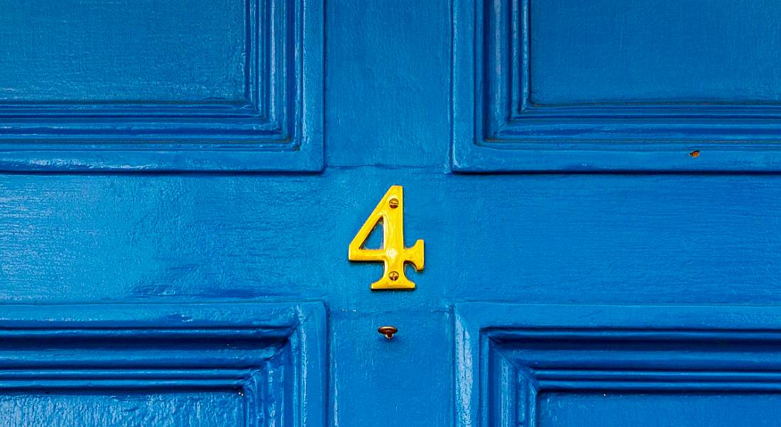 The yellow number four on a blue door.