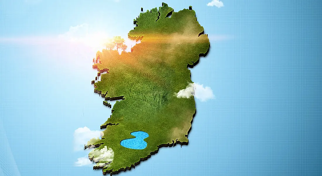 Aerial photorealistic view of Ireland in green on a sky background.