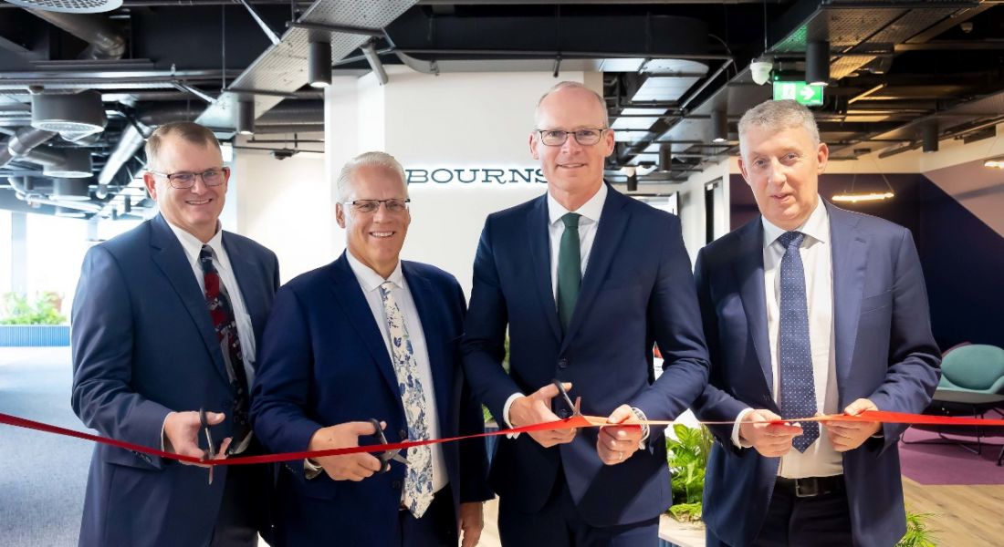 Four men at the cutting of the ribbon ceremony at Bourns new Cork office.