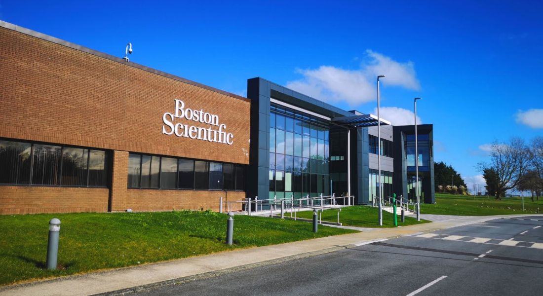 A red-brick building in Clonmel, Ireland with the Boston Scientific logo on it.
