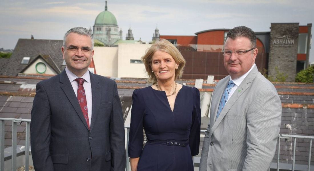 Two men and a woman stand outdoors in Galway at the launch of the new Ministry Brands hub.