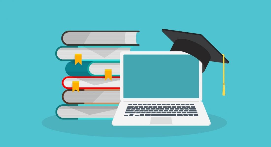 A cartoon image of a laptop with a graduation cap on top and a stack of books behind it, symbolising e-learning.
