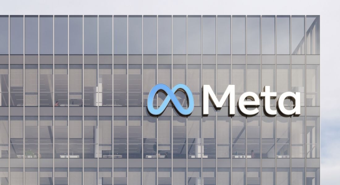 The Meta logo on the front of an office building.