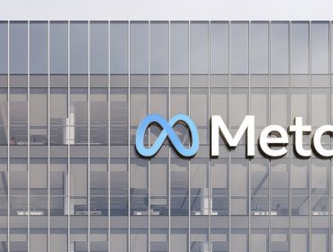 The Meta logo on the front of an office building.