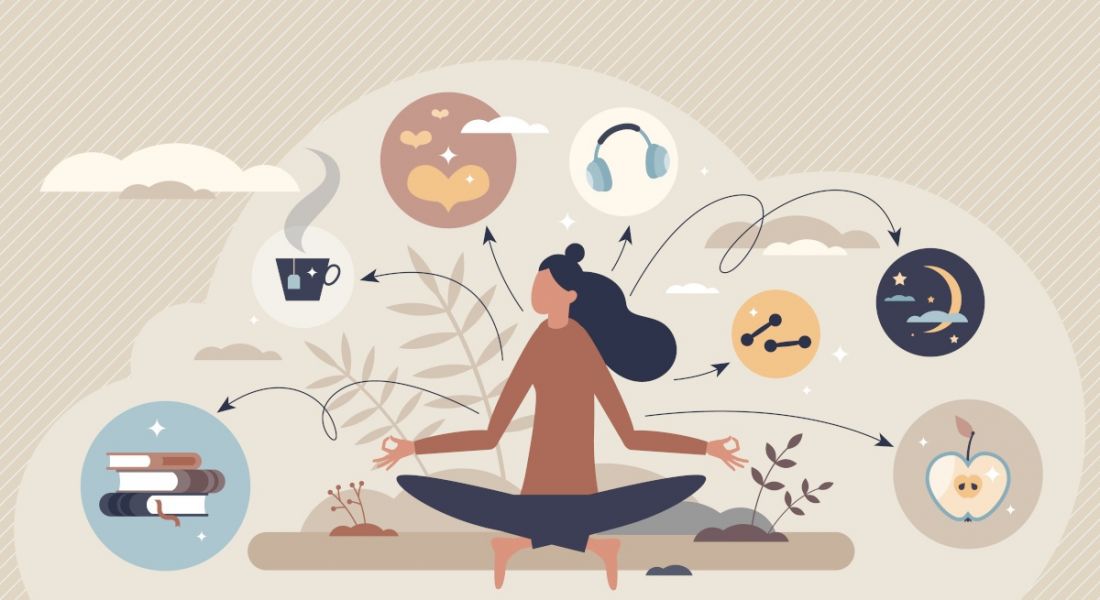A cartoon image of a woman sitting cross-legged with various thought bubbles around her relating to employee wellbeing.