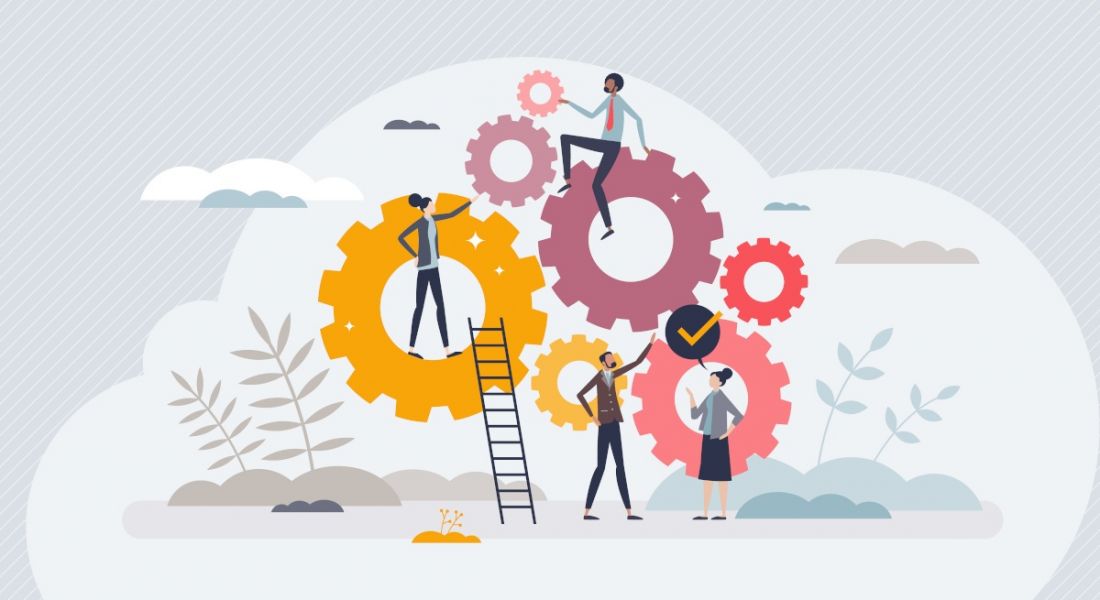 An illustration of a workforce sitting atop various sizes of cogs, symbolising teamwork and development.