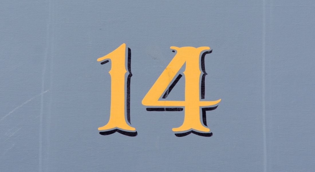 Gold number 14 on a greyish-blue background.