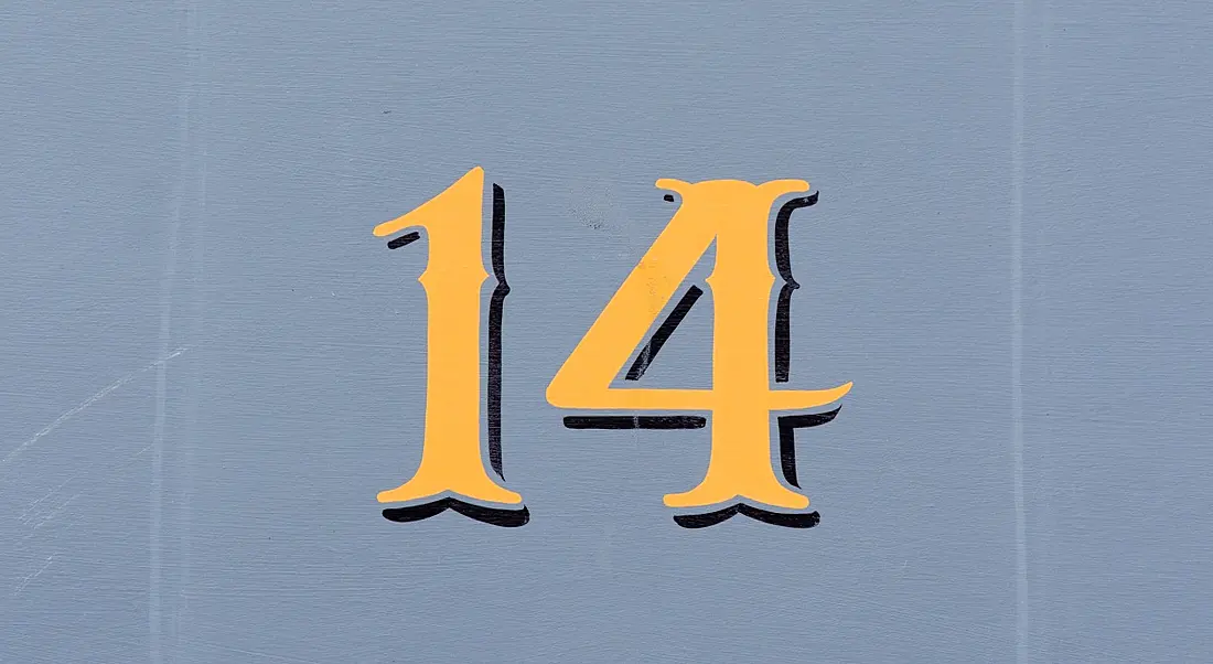 Gold number 14 on a greyish-blue background.