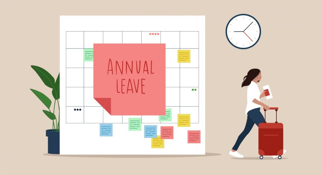 An illustration of a giant calendar with a sticky note labelled 'Annual Leave' stuck in the centre. There is a woman to the right of the calendar walking with a suitcase.