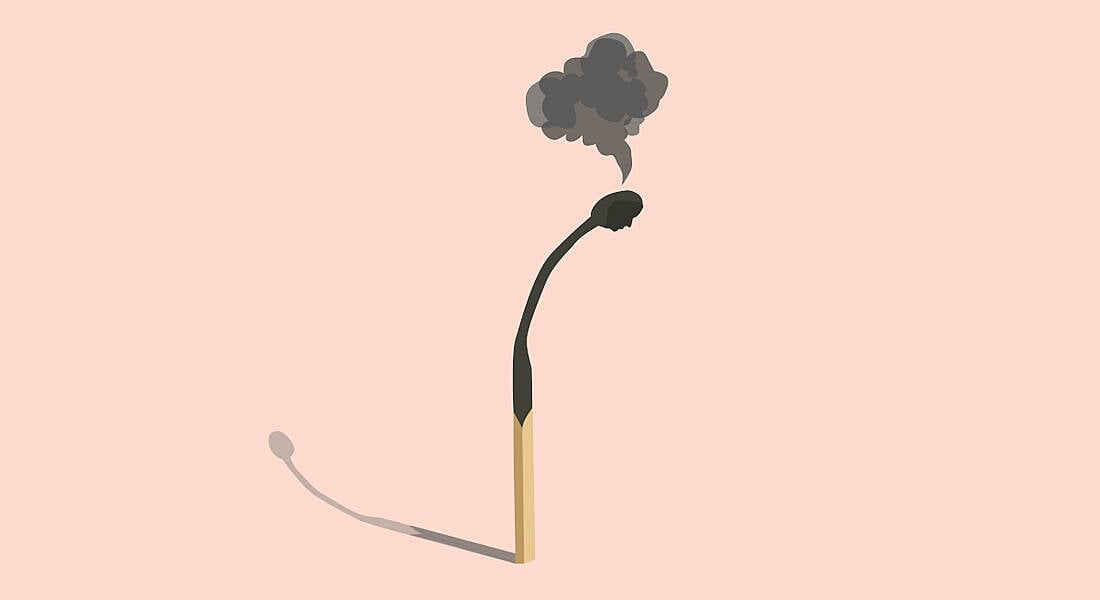 A cartoon of a single match that has been burned. The top is shaped like a head with smoke coming from it, symbolising burnout.