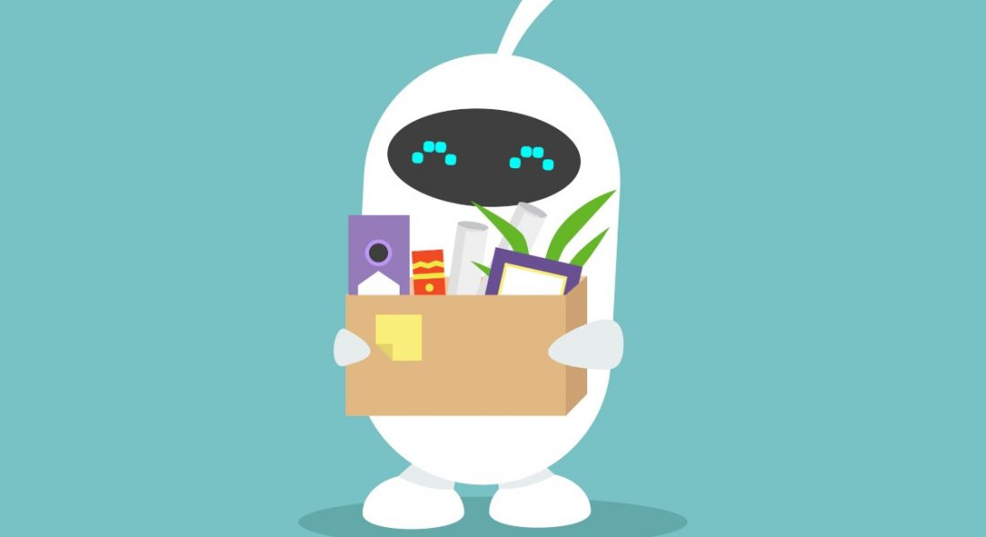 A cartoon white robot holding a box of desk paraphernalia, symbolising AI in the workplace.