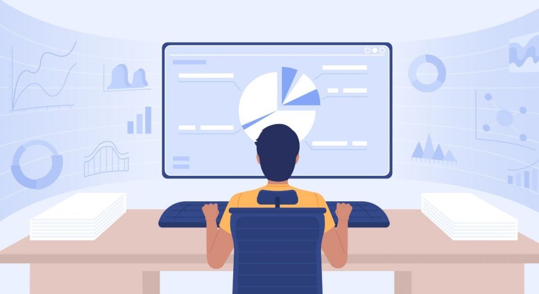 A cartoon image of a man sitting at a desk with a large desktop computer showing data in a pie chart.