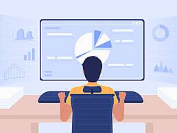 A man sitting at a desk pointing at a screen with a lot of code on it.