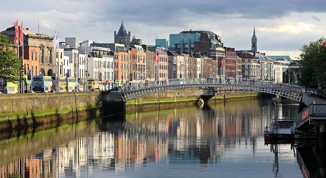 An image of Dublin city with a river and bridge visible in the image.