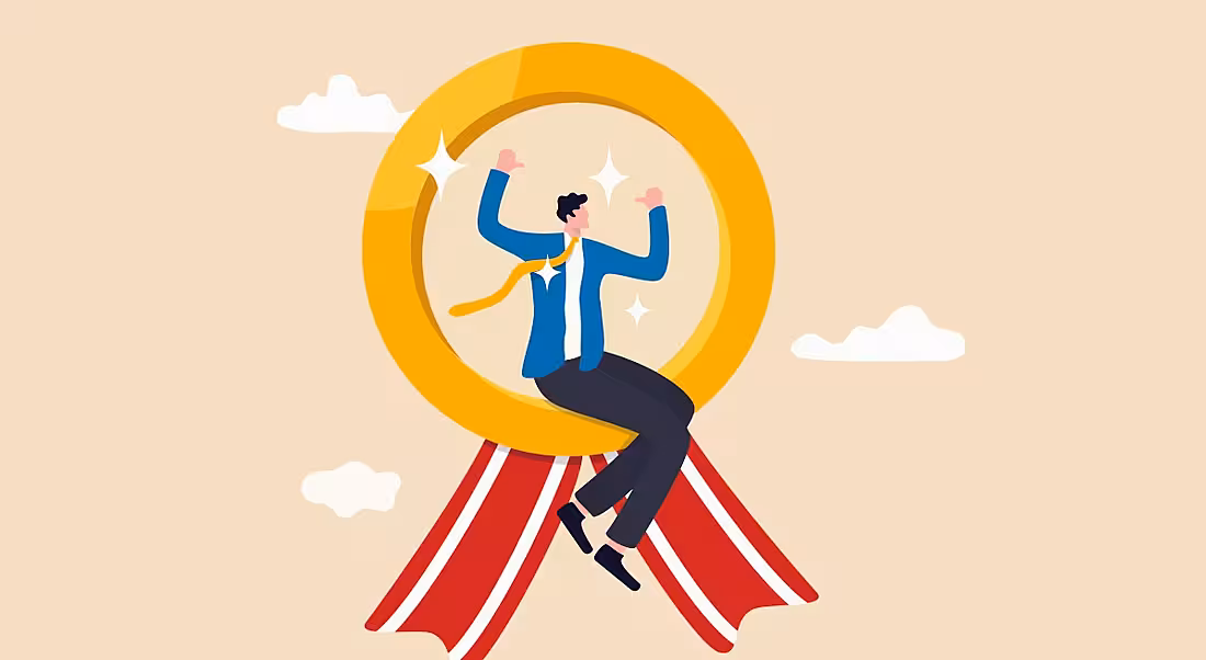 Cartoon of a worker sitting on a giant gold medal with red ribbons hanging off it floating in the sky.