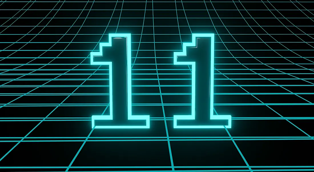 The number 11 in neon blue lights sitting on a grid.