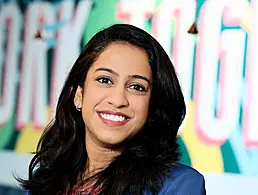 A woman stands smiling at the camera. She is Sonam Chougule, a senior data consultant at BearingPoint Ireland.