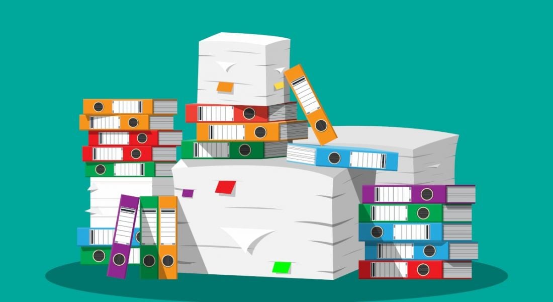 Cartoon of a pile of paper documents and folders containing data stacked on top pf each other.