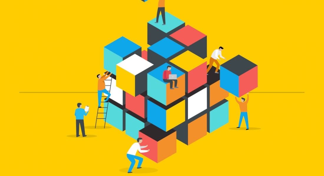 Cartoon of people solving a giant Rubik's cube climbing up ladders and carrying giant blocks.