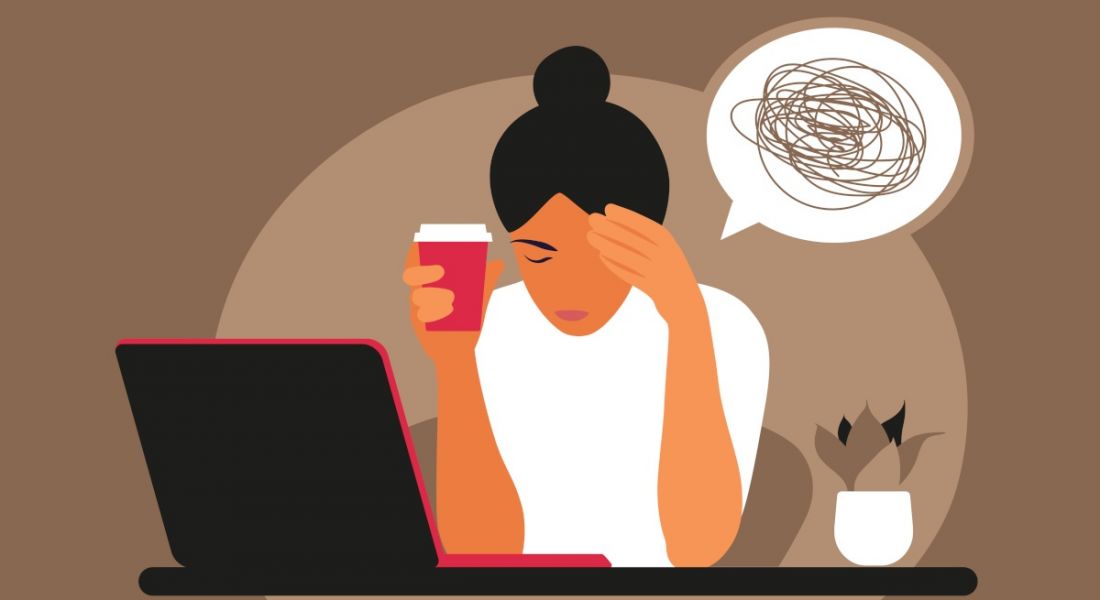 Cartoon showing a worker hunched over her computer with her head in her hand. There is a speech bubble with a scribble in it, indicating she is stressed or unwell.