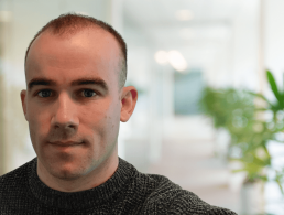 Matthew Beckingham, data scientist at Citi, is smiling into the camera at the company's offices in Dublin.