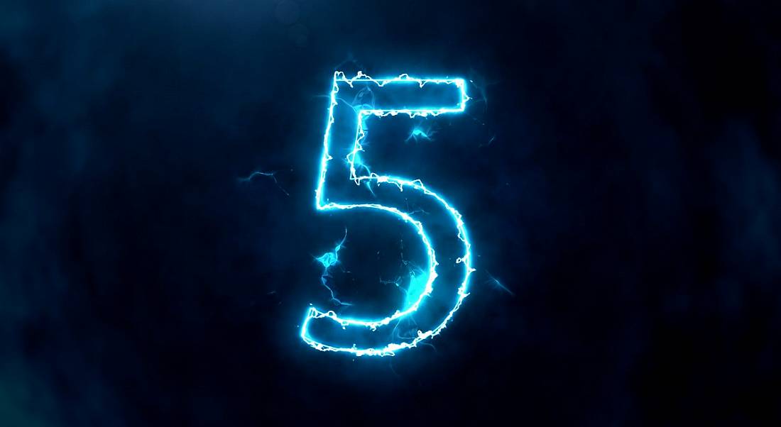 The number five outlined in blue flame against a dark background.